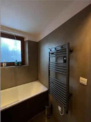 a bathroom with a bath tub and a bath tub at N5 Megève - Résidence de L'ours - appart 4 pers in Megève