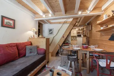 a living room with a couch and a table at Cristal des Glaces 2 - Lac de Gailland - Randonnée - Escalade - Central in Chamonix-Mont-Blanc