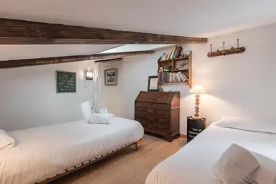 a bedroom with two beds and a dresser at Cristal des Glaces 2 - Lac de Gailland - Randonnée - Escalade - Central in Chamonix-Mont-Blanc