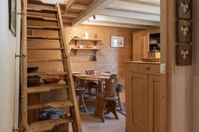 a kitchen with a ladder and a table in a room at Cristal des Glaces 2 - Lac de Gailland - Randonnée - Escalade - Central in Chamonix-Mont-Blanc