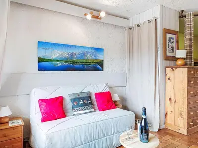 a building covered in snow with a tree at Studio Les Collybies by Interhome in Saint-Gervais-les-Bains