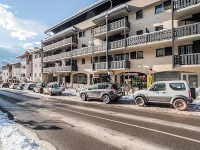 a row of cars parked in front of a building at Apartment La Comtesse-10 by Interhome in Saint-Gervais-les-Bains