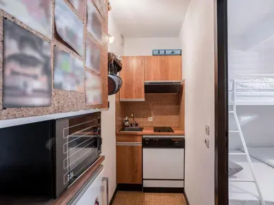 a room with bunk beds and a desk and a window at Apartment La Comtesse-10 by Interhome in Saint-Gervais-les-Bains