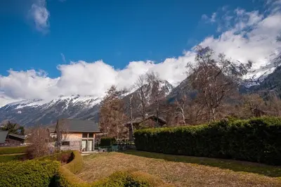 a house with a view of a snow covered mountain at Kinabalu - Vue Mt Blanc Range Les houches center in Les Houches