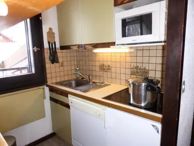 a small kitchen with a sink and a microwave at Résidence Bel'aval - Bel Aval 195 MAE-6364 in Les Contamines-Montjoie