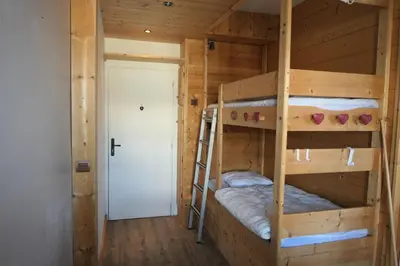 a bedroom with two bunk beds in a cabin at Résidence Les Bruyeres - Bruyères 4 MAE-6354 in Saint-Gervais-les-Bains