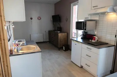 a small kitchen with a sink and a microwave at Résidence Les Bruyeres - Bruyères 4 MAE-6354 in Saint-Gervais-les-Bains