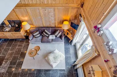 an overhead view of a living room with a couch at La Suite Darray - Welkeys in Megève