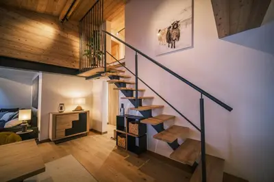 a bedroom with a large bed with a large window at Loft Zodiak -Centre Ville 4 Chambres Vue in Les Houches