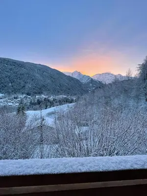 a view of a snow covered valley with mountains at CHALET UTOPIA in Saint-Gervais-les-Bains