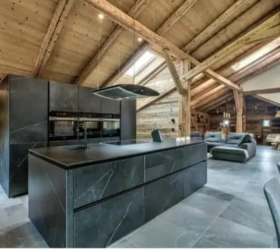 a large dining room with a long table and chairs at Chalet de L'Ours Blanc in Saint-Gervais-les-Bains