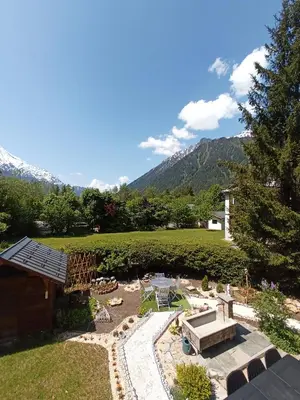 a view of a garden with mountains in the background at le jardin de talèfre in Chamonix-Mont-Blanc