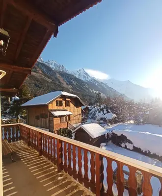 a view from the balcony of a house with snow at le jardin de talèfre in Chamonix-Mont-Blanc