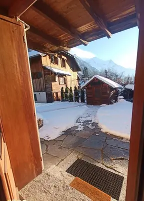 a view from the door of a house in the snow at le jardin de talèfre in Chamonix-Mont-Blanc