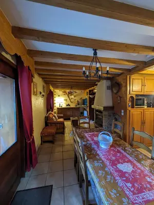 a living room with a dining table and a living room at le jardin de talèfre in Chamonix-Mont-Blanc