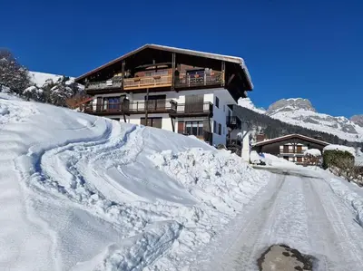 a building on a snow covered mountain with a road at Appartement - Vue Mont-Blanc in Cordon