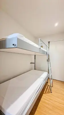 a bunk bed with a ladder on top of it at Résidence Andromede - Studio entièrement rénové · Proche des pistes MAE-8254 in Magland