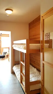 a bunk room with two bunk beds in it at Résidence Chateaux De Crans - Studio lumineux · Balcon MAE-8264 in Magland