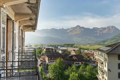 a balcony with a view of snow covered mountains at Résidence du Parc - Happy Rentals in Saint-Gervais-les-Bains