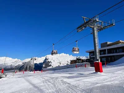a ski lift with a snow covered mountain in the background at Samoens 1600, ski au pied in Samoëns
