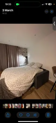 a bedroom with a bed in a room with a tv at Le Sasha in Chamonix-Mont-Blanc