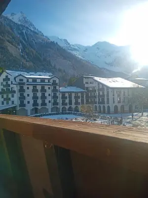 a view of a building with mountains in the background at Le Sasha in Chamonix-Mont-Blanc
