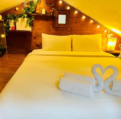 a bed with two towels with hearts on it at Mazot cozy chalet spirit in Chamonix in Chamonix-Mont-Blanc