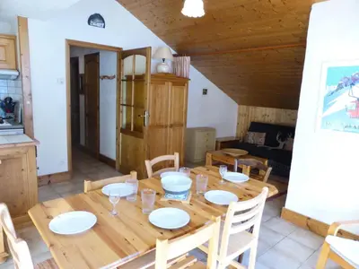 a dining room with a wooden table and chairs at Résidence Berangere - Bérangère 33 MAE-0704 in Les Contamines-Montjoie