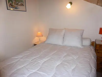 a white bed with white pillows in a bedroom at Résidence Berangere - Bérangère 33 MAE-0704 in Les Contamines-Montjoie