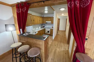 a small bedroom with a bed and a window at Large apartment in Chamonix - close to the slopes in Chamonix-Mont-Blanc