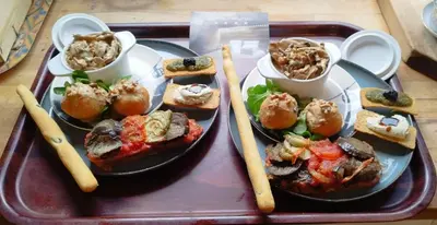 a tray of food with sandwiches and chopsticks on it at Amour & Chocolat in Sixt