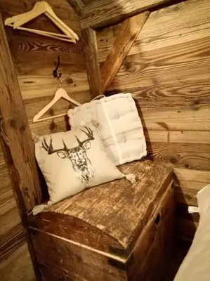 a room with a pillow with a deer on it at Amour & Chocolat in Sixt