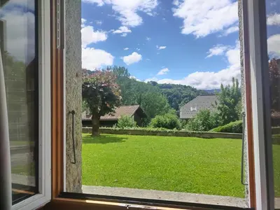 a window with a view of a yard at LaResidence in Saint-Gervais-les-Bains