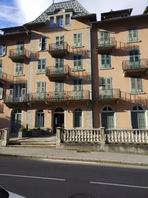 a large building with balconies on the side of a street at LaResidence in Saint-Gervais-les-Bains