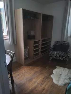 a living room with a couch and a chair at LaResidence in Saint-Gervais-les-Bains