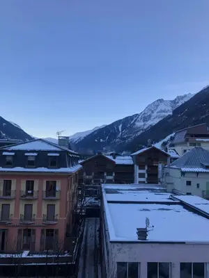 a city with snow on the roofs of buildings at Superbe studio refait à neuf et tout équipé avec parking in Chamonix-Mont-Blanc