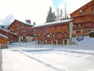 a house with a swimming pool next to a building at Apartment Les G'rets-12 by Interhome in Saint-Gervais-les-Bains