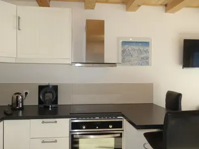 a bedroom with a bed and a large window at Apartment Les G'rets-12 by Interhome in Saint-Gervais-les-Bains