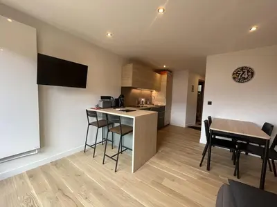 a kitchen and living room with a table and chairs at Charmant Studio-Cabine 4 pers, Centre-Village, Balcon Ouest, à 600m des Pistes - FR-1-572-281 in Arâches-la-Frasse