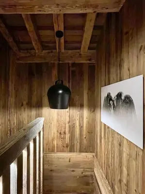 a hallway with a black light and a picture on the wall at Chalet de luxe sur les pistes - 5 chambres in Combloux