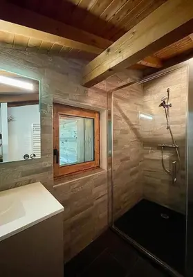 a bathroom with a shower and a sink at Chalet de luxe sur les pistes - 5 chambres in Combloux