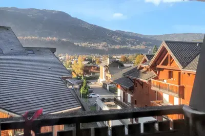 a view from the balcony of a house at Appartement cosy à Samoëns de 57 m² avec balcon. in Samoëns