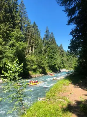 a group of people rafting down a river at Appartement cosy à Samoëns de 57 m² avec balcon. in Samoëns
