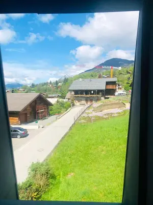 a view from a train window of a village at Appartement cosy à Samoëns de 57 m² avec balcon. in Samoëns
