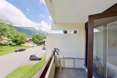 a balcony with a view of a street at Studio moderne de 18m2 aux carroz d'arâches in Les Carroz d'Araches