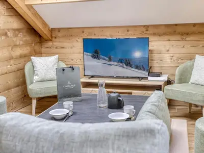 a bedroom with a bed with red pillows at Appartement accueillant 6 pers, proche centre et télécabine, wifi inclus - FR-1-663-19 in Saint-Gervais-les-Bains