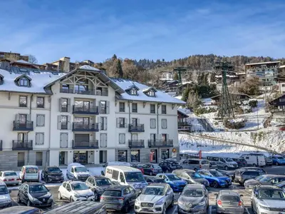 a kitchen with white cabinets and a counter top at Appartement accueillant 6 pers, proche centre et télécabine, wifi inclus - FR-1-663-19 in Saint-Gervais-les-Bains
