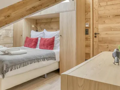 a living room with a table and two chairs and a tv at Appartement accueillant 6 pers, proche centre et télécabine, wifi inclus - FR-1-663-19 in Saint-Gervais-les-Bains