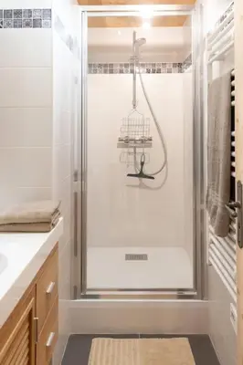 a shower with a glass door in a bathroom at Gîte Ferme Sixt-Fer-à-Cheval in Sixt