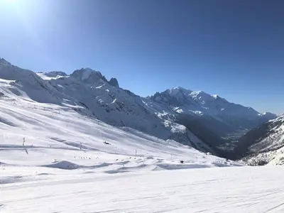 a group of people skiing down a snow covered mountain at Chez Charles I Vallorcine Viachamonix in Vallorcine